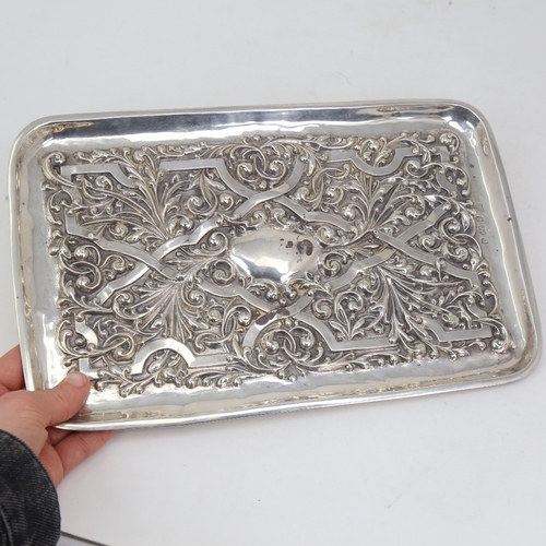 1122 - An Edwardian rectangular silver tray, allover relief embossed foliate decoration, by Williams Birmin... 