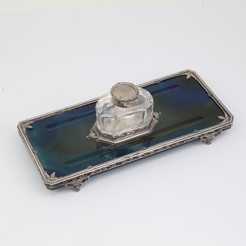 1132 - An Edwardian polished blue agate and silver inkwell desk stand, with removeable cut-glass silver-mou... 