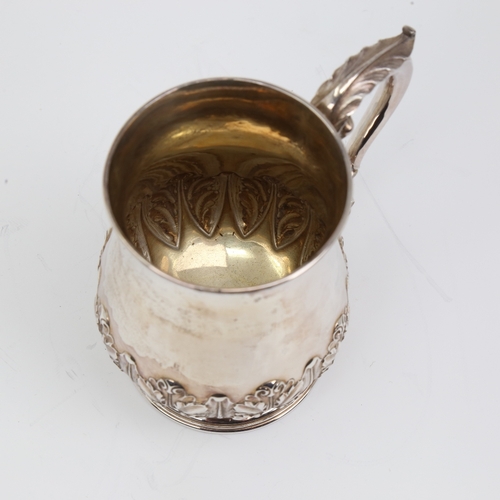 1133 - An Edwardian silver half pint tankard mug, cylindrical baluster form with relief embossed acanthus l... 