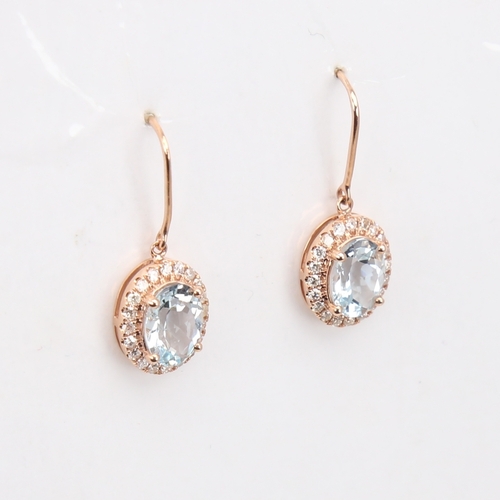 1135 - A modern pair of 14ct rose gold aquamarine and diamond cluster pendant earrings, set with oval-cut a... 