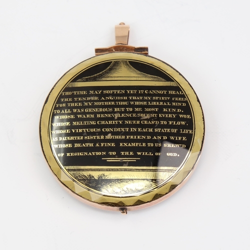 1137 - A fine and large Georgian mourning pendant, circular form with unmarked yellow metal frame, the fron... 