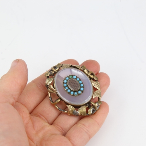 1141 - A Victorian unmarked yellow metal chalcedony turquoise and hair panel mourning brooch, floral settin... 