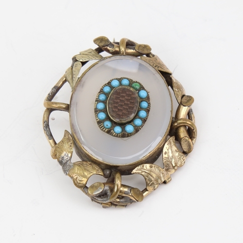 1141 - A Victorian unmarked yellow metal chalcedony turquoise and hair panel mourning brooch, floral settin... 