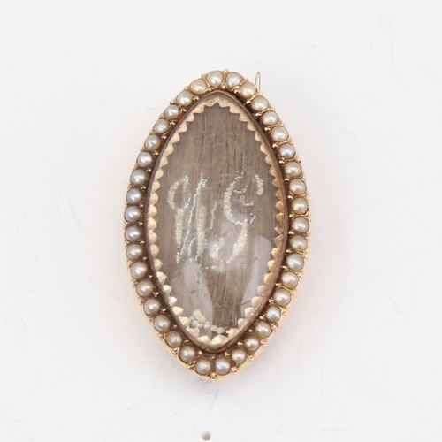 1143 - A fine Georgian marquise mourning brooch, unmarked gold settings with straightened hair panel embell... 