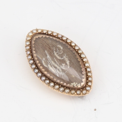 1143 - A fine Georgian marquise mourning brooch, unmarked gold settings with straightened hair panel embell... 