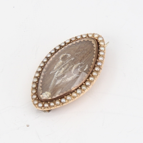 1143 - A fine Georgian marquise mourning brooch, unmarked gold settings with straightened hair panel embell... 