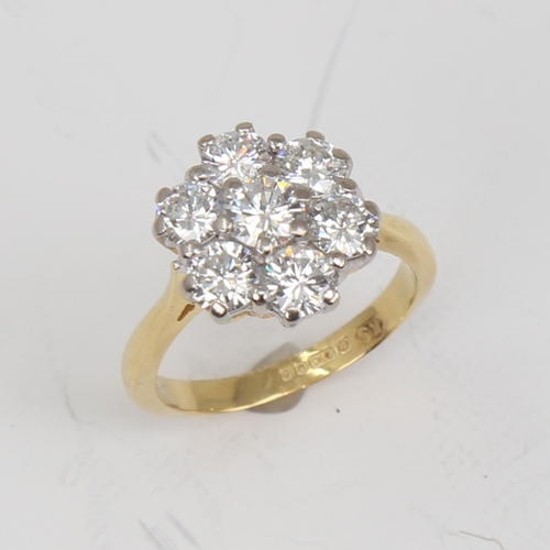 1152 - A late 20th century 18ct gold 7-stone diamond cluster flowerhead ring, set with modern round brillia... 