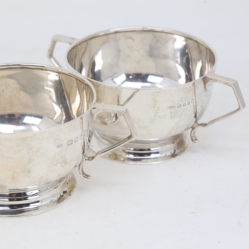 1157 - An Art Deco silver matching cream jug and sugar bowl, circular form with geometric handles, by Josia... 