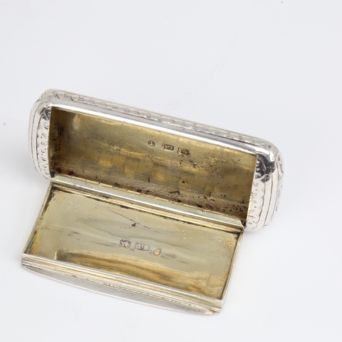 1161 - A Victorian silver snuffbox, rectangular cushion form with bright-cut engraved decoration and gilt i... 