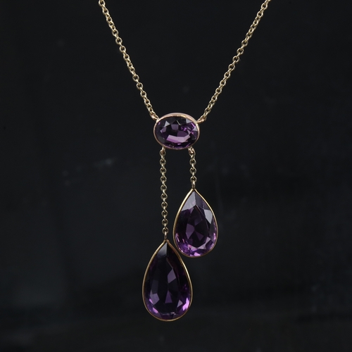 1166 - ***WITHDRAWN*** A 9ct gold amethyst negligee pendant necklace, set with oval mixed-cut amethyst susp... 