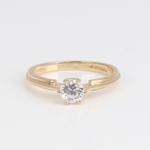 1168 - A modern 14ct gold solitaire cubic zirconia ring, set with modern round brilliant-cut CZ, diameter 4... 