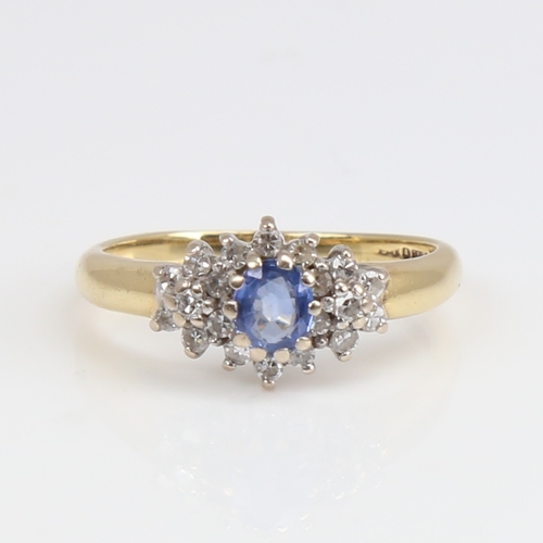 1170 - A late 20th century 18ct gold sapphire and diamond cluster ring set with oval mixed-cut sapphire and... 