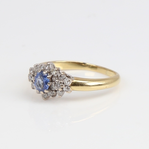 1170 - A late 20th century 18ct gold sapphire and diamond cluster ring set with oval mixed-cut sapphire and... 