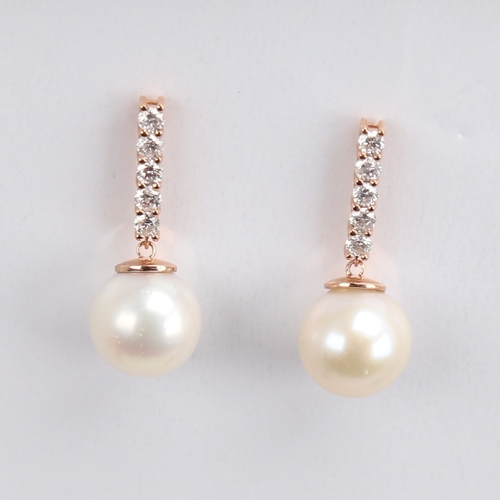 1171 - A modern pair of 14ct rose gold whole cultured pearl and diamond drop earrings, set with a line of m... 