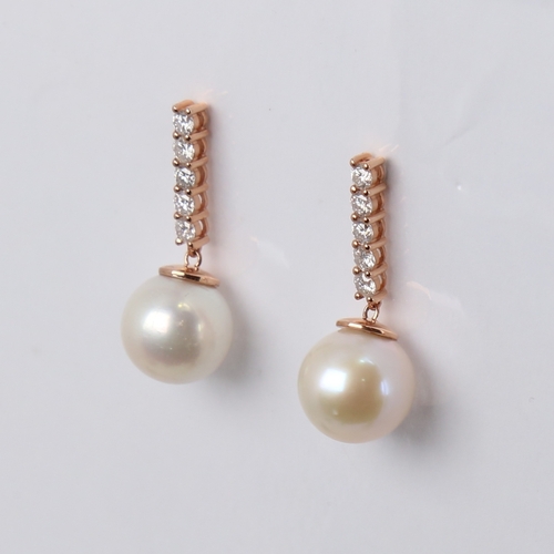 1171 - A modern pair of 14ct rose gold whole cultured pearl and diamond drop earrings, set with a line of m... 