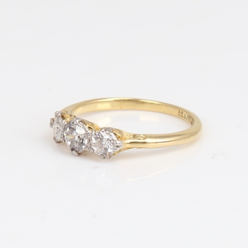 1176 - An early 20th century 18ct gold 3-stone diamond ring, set with round brilliant-cut diamonds, total d... 