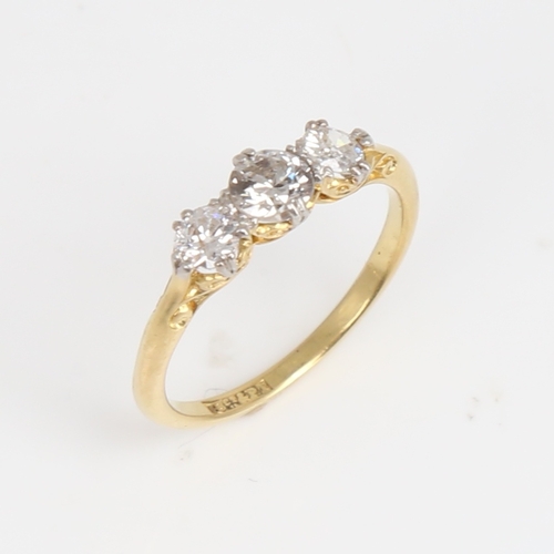 1176 - An early 20th century 18ct gold 3-stone diamond ring, set with round brilliant-cut diamonds, total d... 