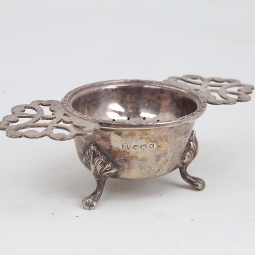 1181 - An Elizabeth II silver tea strainer and stand, by John Turton & Co, hallmarks Sheffield 1965/1967, s... 