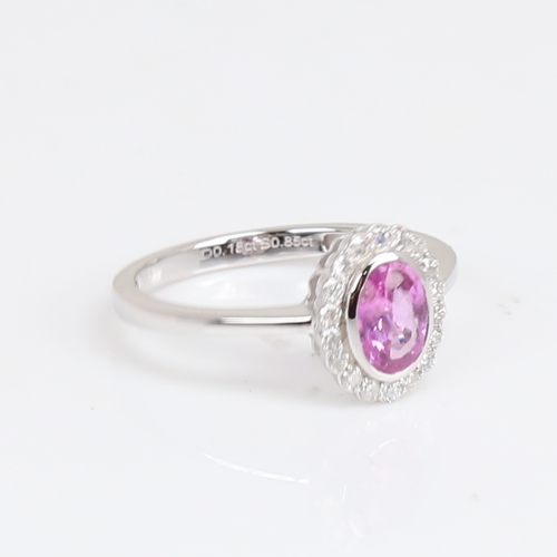 1182 - A modern 14ct white gold pink sapphire and diamond cluster ring, set with oval mixed-cut sapphire an... 