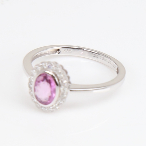 1182 - A modern 14ct white gold pink sapphire and diamond cluster ring, set with oval mixed-cut sapphire an... 