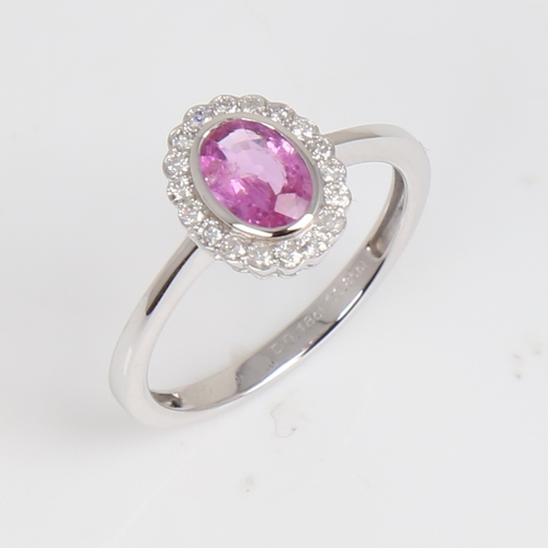 1182 - A modern 14ct white gold pink sapphire and diamond cluster ring, set with oval mixed-cut sapphire an... 