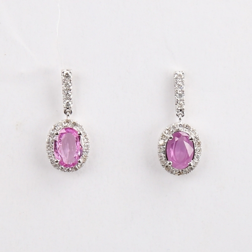 1183 - A modern pair of 14ct white gold pink sapphire and diamond cluster drop earrings, set with oval mixe... 