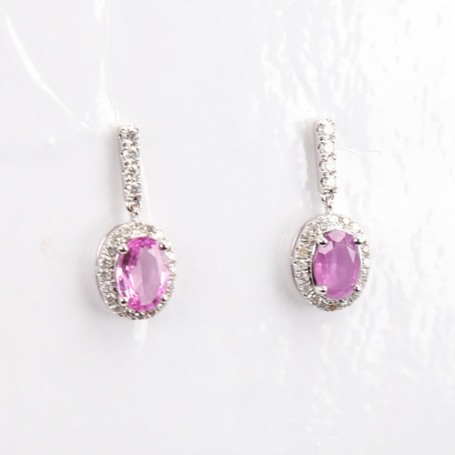 1183 - A modern pair of 14ct white gold pink sapphire and diamond cluster drop earrings, set with oval mixe... 