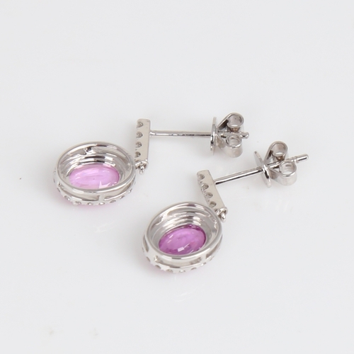 1183 - A modern pair of 14ct white gold pink sapphire and diamond cluster drop earrings, set with oval mixe... 