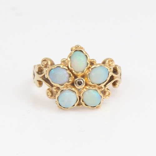 1187 - An 18ct gold cabochon opal and diamond cluster flowerhead ring, pierced and engraved scrollwork shou... 