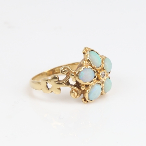 1187 - An 18ct gold cabochon opal and diamond cluster flowerhead ring, pierced and engraved scrollwork shou... 