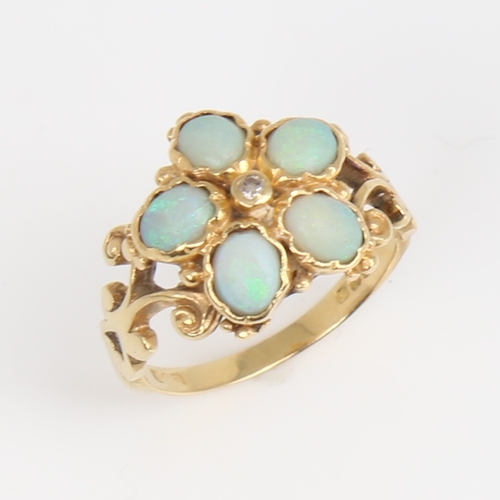 1187 - An 18ct gold cabochon opal and diamond cluster flowerhead ring, pierced and engraved scrollwork shou... 