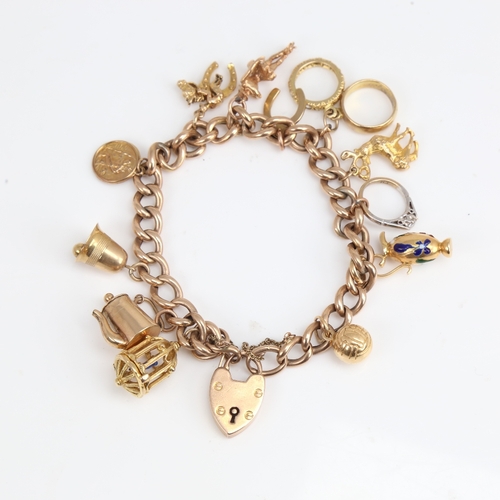 1194 - A 9ct gold curb link heart padlock charm bracelet with 11 9ct charms and 1 18ct charm, bracelet leng... 