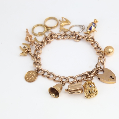 1194 - A 9ct gold curb link heart padlock charm bracelet with 11 9ct charms and 1 18ct charm, bracelet leng... 