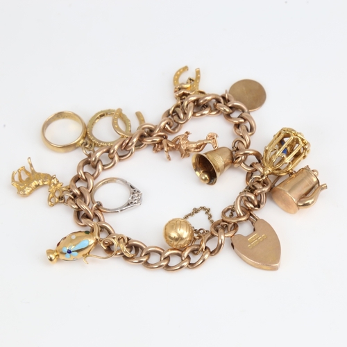 1194 - A 9ct gold curb link heart padlock charm bracelet with 11 9ct charms and 1 18ct charm, bracelet leng... 