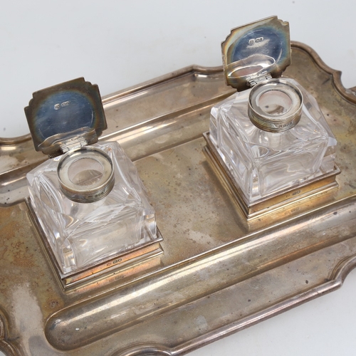 1199 - An Edwardian silver 2-handled deskstand, rectangular form with scalloped rim, 2 pen trays and silver... 