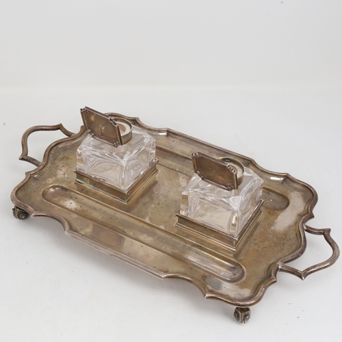 1199 - An Edwardian silver 2-handled deskstand, rectangular form with scalloped rim, 2 pen trays and silver... 