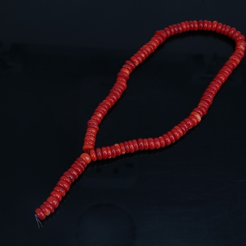 1203 - A string of red coral beads, necklace length 34cm, 65.3g