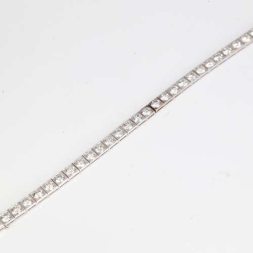 1205 - A fine Vintage 18ct white gold diamond line bracelet, set with 32 modern round brilliant-cut diamond... 