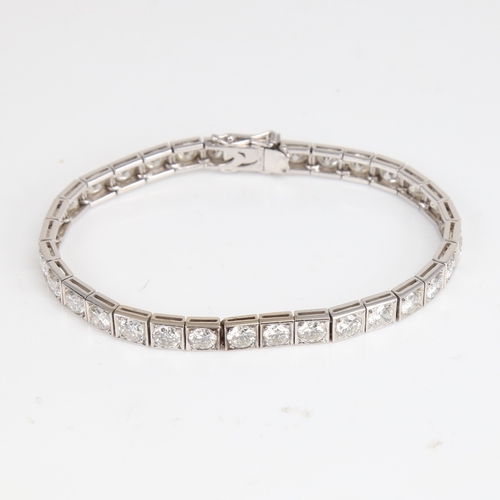 1205 - A fine Vintage 18ct white gold diamond line bracelet, set with 32 modern round brilliant-cut diamond... 