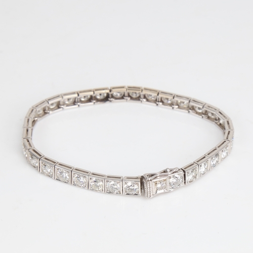 1205 - A fine Vintage 18ct white gold diamond line bracelet, set with 32 modern round brilliant-cut diamond... 