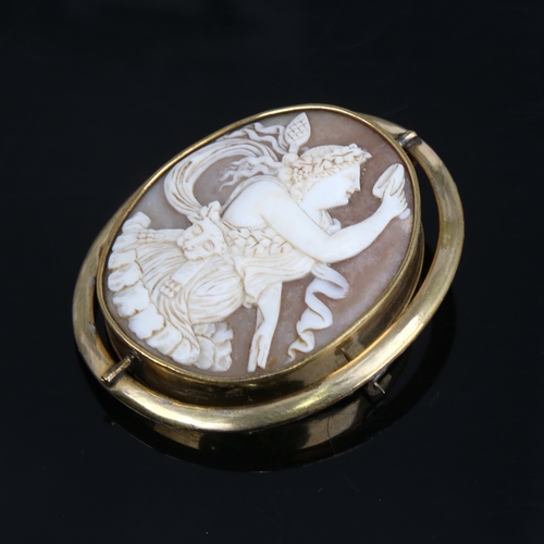 1207 - A Victorian relief carved shell cameo swivel brooch, depicting Bacchante lady with lion pelt and thy... 