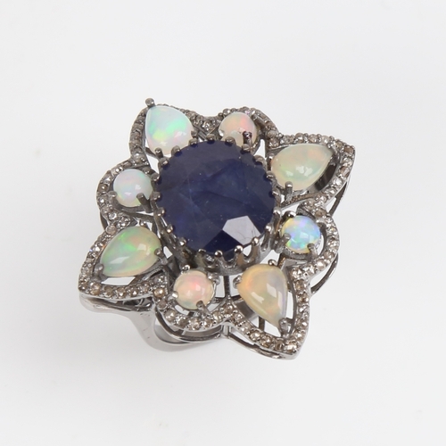 1210 - A large modern oxidised silver sapphire opal and diamond star ring, openwork set with oval mixed-cut... 