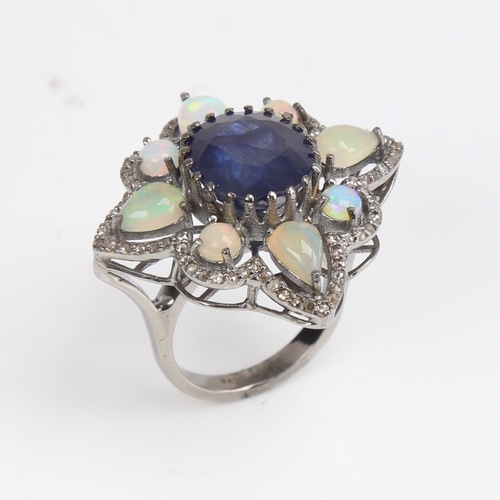 1210 - A large modern oxidised silver sapphire opal and diamond star ring, openwork set with oval mixed-cut... 