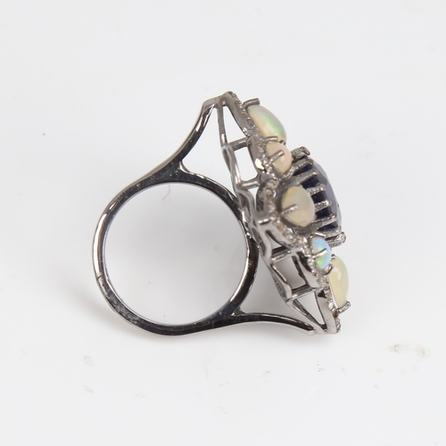 1210 - A large modern oxidised silver sapphire opal and diamond star ring, openwork set with oval mixed-cut... 