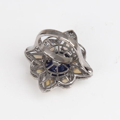 1210 - A large modern oxidised silver sapphire opal and diamond star ring, openwork set with oval mixed-cut... 