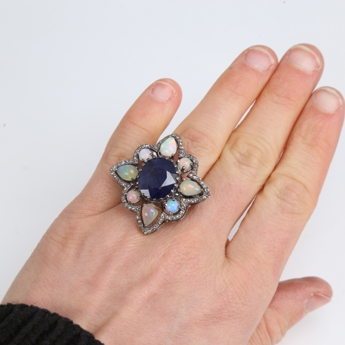 1210 - A large modern oxidised silver sapphire opal and diamond star ring, openwork set with oval mixed-cut... 