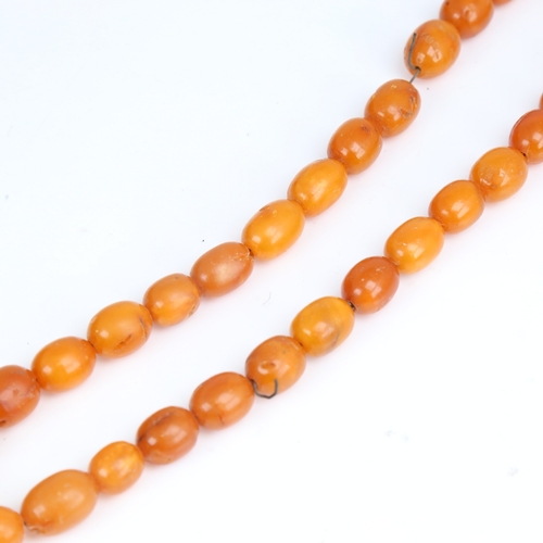 1212 - A Vintage single-row butterscotch amber bead necklace, bead length approx 14.8mm, necklace length 40... 