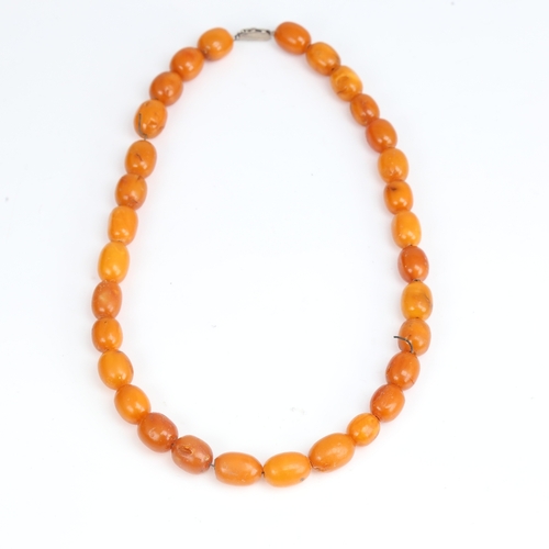 1212 - A Vintage single-row butterscotch amber bead necklace, bead length approx 14.8mm, necklace length 40... 