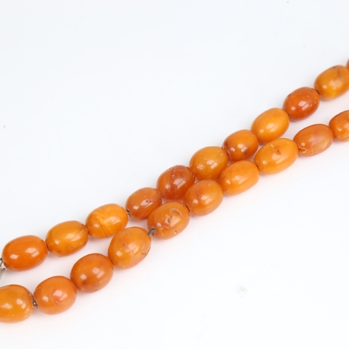 1212 - A Vintage single-row butterscotch amber bead necklace, bead length approx 14.8mm, necklace length 40... 