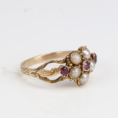 1227 - A Victorian unmarked gold split-pearl and ruby cluster memorial ring, central flowerhead design with... 